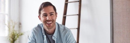 man_sitting_in_front_of_ladder-banner